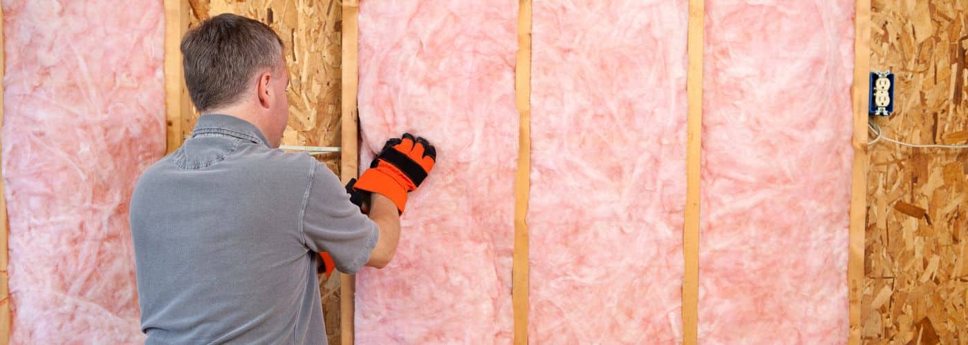 installer installing home insulation in seattle home attic